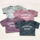 Four baby onesies with 'Future Dog Walker' text in different colors on a light background